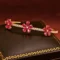 14k yellow gold ruby bangle with diamond accents