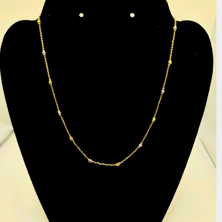 Enhance your everyday style with this elegant 22KT Gold Chain, crafted with delicate gold and white beaded accents. Weighing 5.26 grams, its minimalist design makes it perfect for daily wear, layering with pendants, or gifting. A timeless staple for any fine jewelry collection.