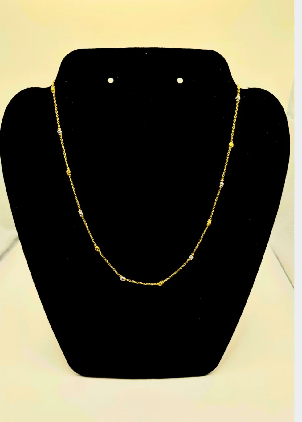 Enhance your everyday style with this elegant 22KT Gold Chain, crafted with delicate gold and white beaded accents. Weighing 5.26 grams, its minimalist design makes it perfect for daily wear, layering with pendants, or gifting. A timeless staple for any fine jewelry collection.