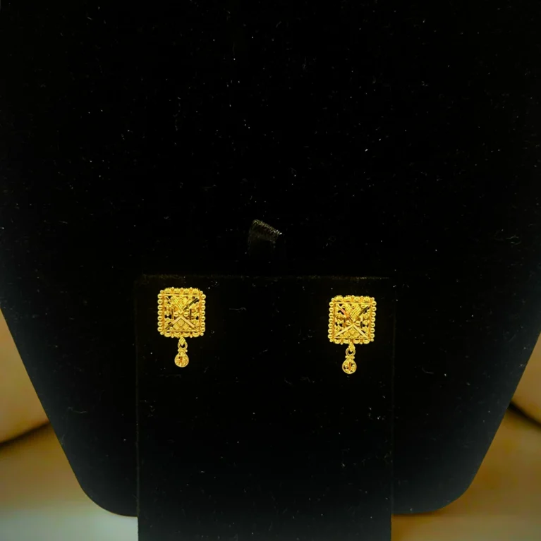 Handcrafted in 4.00 grams of 22KT gold, the Majestic Charm Earrings feature intricate square motifs and delicate gold drops — perfect for festive elegance and timeless style.
