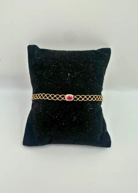 18KT gold bracelet with oval ruby center stone