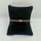 18KT gold bracelet with oval ruby center stone