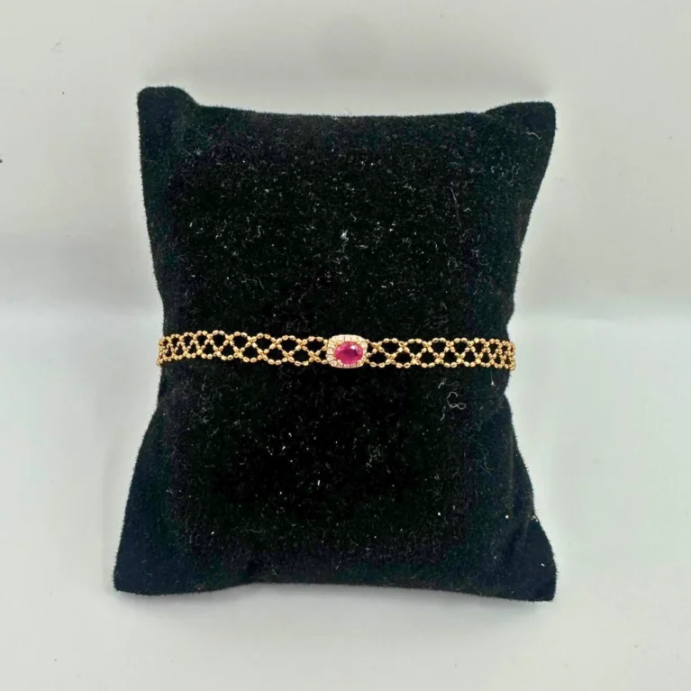 18KT gold bracelet with oval ruby center stone