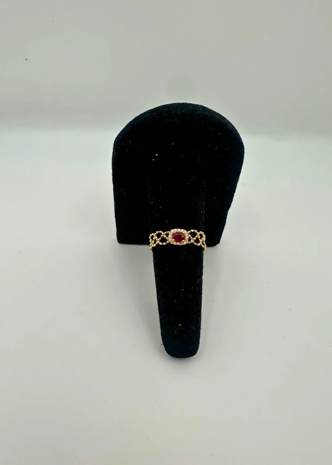 Ruby halo 18KT gold chain bracelet with oval gemstone