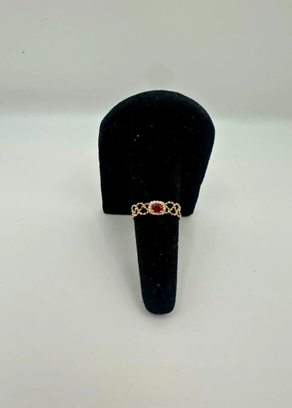 Ruby halo 18KT gold chain bracelet with oval gemstone