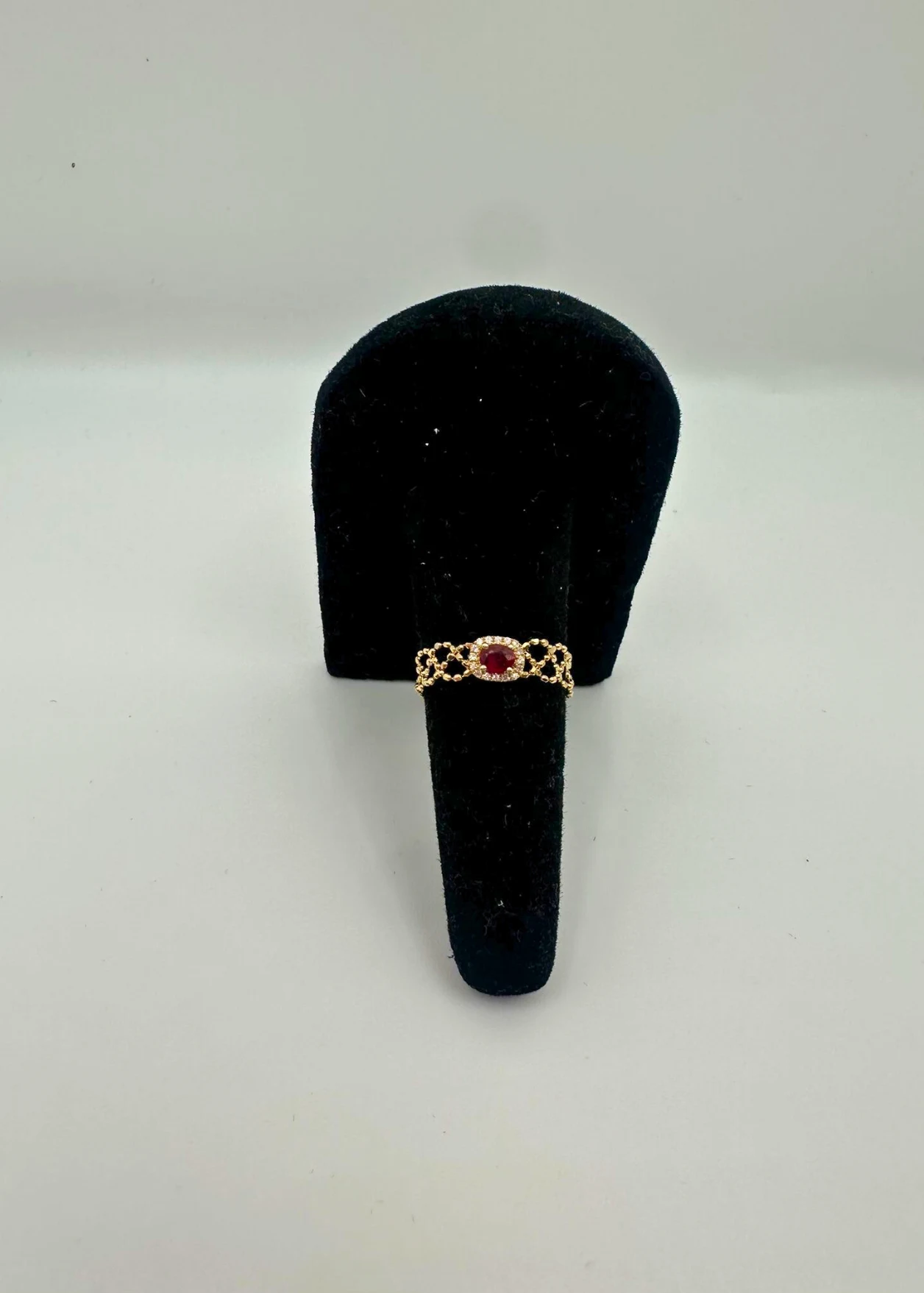 Ruby halo 18KT gold chain bracelet with oval gemstone